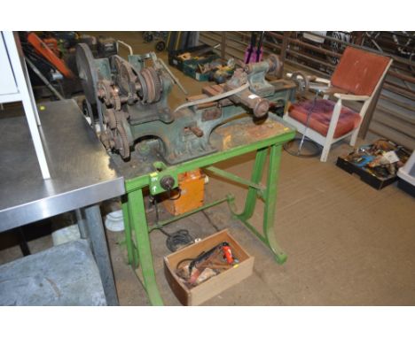 A vintage metal lathe and a box of bits 