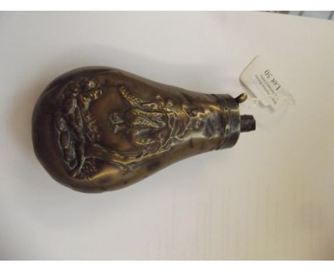 19th century brass powder flask, embossed body depicting hanging pheasants, some dents 