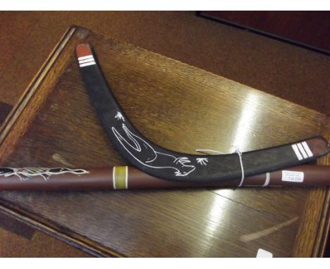 Souvenir ware didgeridoo together with a boomerang  