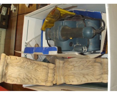 Electric belt sander with spare sandpaper together with a pair of acanthus leaf capped corbels 