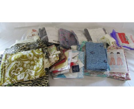 Box of vintage textiles, patchwork squares and dress making patterns etc