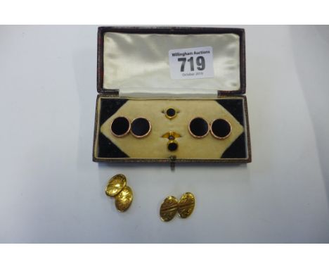 A pair of 9ct gold oval clufflinks, weight approx 1.6 grams, and a cased set of gilt metal and black onyx cufflinks and studs