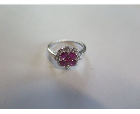 A 14ct white gold four stone ruby and diamond ring, size N, approx 2.9 grams, in good condition 