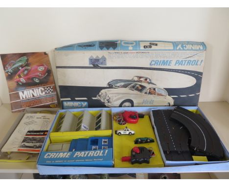 A Minic Motorways Crime Patrol 3.4 Jaguar Police car and E-type Jaguar, not tested, may need some attention 