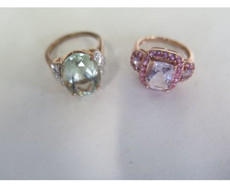 Two pink 9ct gold dress rings, one set with small diamonds and a pale green stone, size Q, the second set with pink stones, s