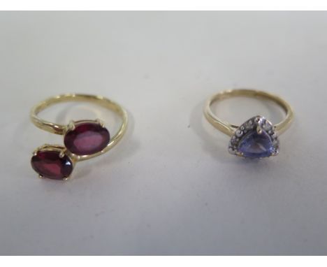 A 9ct white gold tanzanite and diamond ring, size K, approx weight 2 grams, also a 9ct gold and garnet ring, size N 1/2 - app