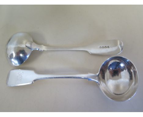 A pair of Georgian silver sauce ladles, London 1813 - maker William Eaton, approx weight 5 troy oz, with monogram, light surf