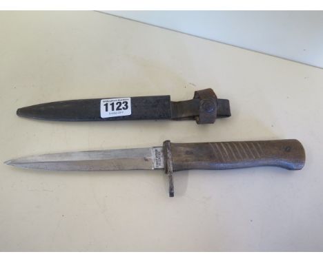 A WWI German trench dagger with steel scabbard, blade by Ernst Busch, Solingen, possibly export blade, a Native/African made 