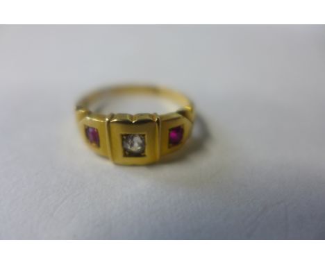 An 18ct diamond and ruby ring, size N, approx 3.7 grams, general usage wear 