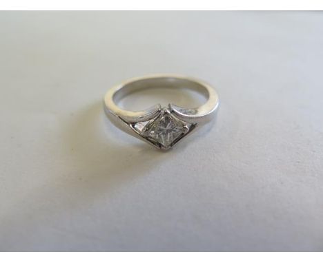 A 950 platinum diamond solitaire ring, the square cut diamond approx 0.60ct, ring size O, approx 9.4 grams, diamond bright so