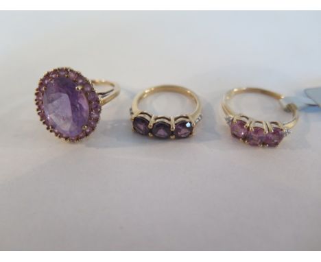 Three 9ct gold and amethyst rings, sizes J 1/2, N and N 1/2 - total weight approx 8.1 grams - all in good condition 