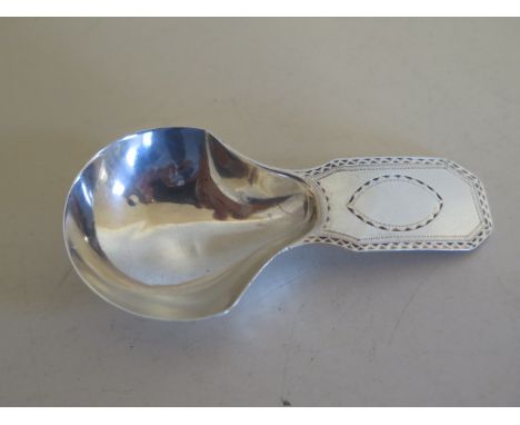 A fine bright cut silver caddy spoon, by George Smith and William Fearn, London 1789 - length 7.5cm, over stamp on makers mar