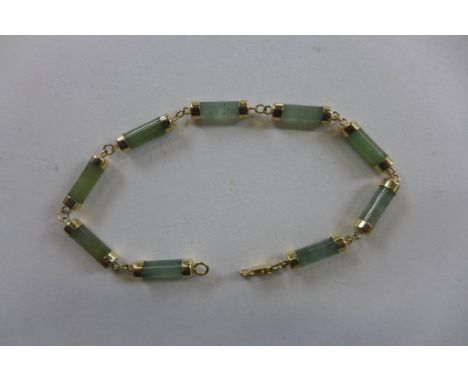 A 14ct gold jade bracelet, 18cm long, approx 6.4 grams, generally good condition 