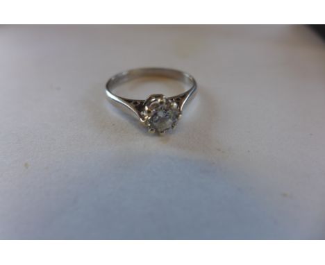 An 18ct white gold solitaire ring, diamond approx 0.70ct, ring size N, approx 3 grams, diamond bright, generally good, some u