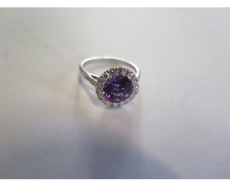 An 18ct white gold amethyst and diamond ring, size N approx 2.7 grams, head approx 12mm diameter, in good condition 