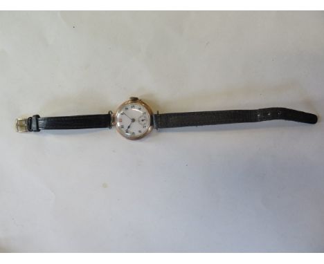 A 9ct manual wind Dreadnought wristwatch, on a leather strap, 25mm wide, running 