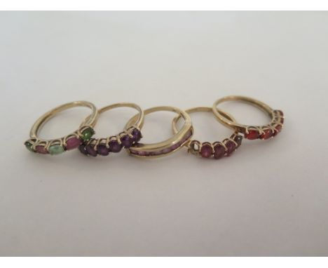 Five 9ct gold dress rings, set with various stones, including garnet, amethyst, sizes N 1/2 to O 1/2 - total weight 9.3 grams