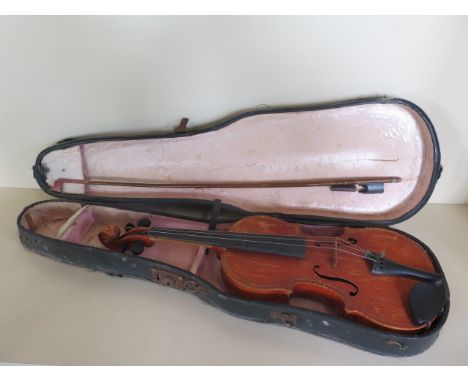 A violin with a two piece 13 1/4 inch back, and Mockba label dated 65, with an un-named bow, and hard case, in need of some r