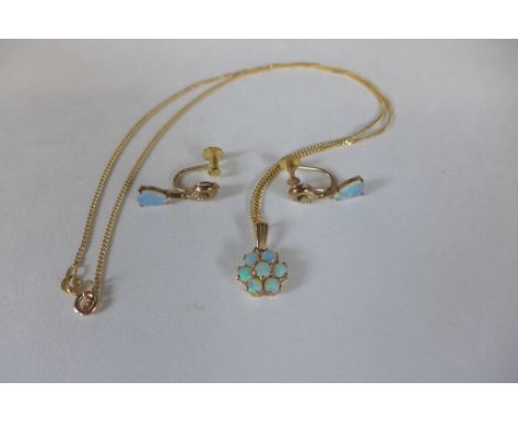 A 9ct yellow gold opal cluster pendant on a 9ct chain and a pair of 9ct opal earrings, total weight approx 5.4 grams 