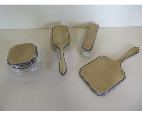 A Mappin and Webb silver and enamel back piece dressing table set, London 1937/38 - generally good, minor damage to handle of