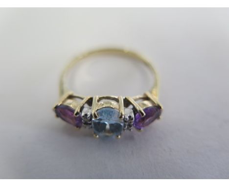 A 9ct gold aquamarine, diamond and amethyst ring, shank size Q, weight approx 2.1 grams 