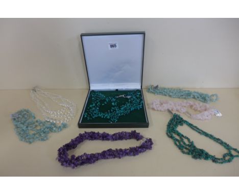 A collection of polished uncut semi-precious stone, necklaces including turquoise x two, amethyst, amazonite x two, rose quar