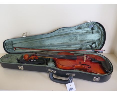 A Karl Hofner violin with label dated 1989 - with a 14 inch two piece back, hard case and un-named bow 