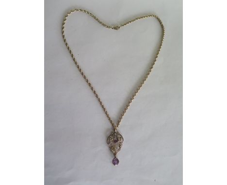 An Edwardian 9ct gold amethyst and seed pearl pendant on 9ct rope chain, pendant length 5cm, width 2.2cm, chain length 50cm, 