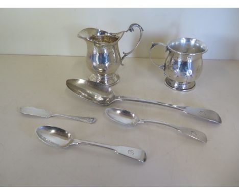 A silver helmet shaped cream jug, a small dented tankard and four pieces of silver flatware, approx 8.3 troy oz 