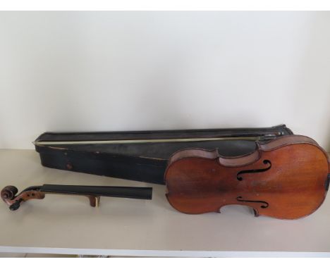 A violin with a two piece 4 inch back, part visible label, Laum aris possibly Vuillaume Paris, in need of restoration with a 