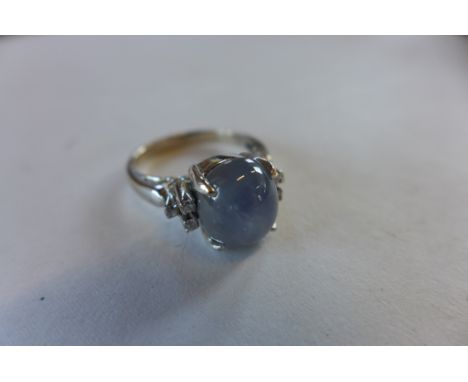 An 18ct white gold moonstone and diamond ring, size K, approx 4.2 grams, generally good condition, small flaw to stone 