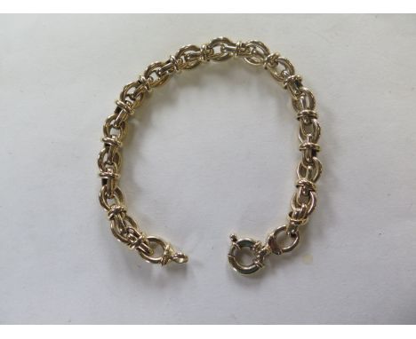 A 9ct yellow gold link bracelet, approx 33.8 grams, 21cm long, some light usage wear, generally good 