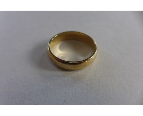 A 9ct gold band ring, size N, approx 3.1 grams, some usage marks but generally good 
