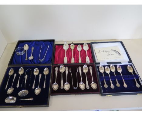 Two silver boxed spoon sets, and other silver flatware, two napkin rings , total weight approx 12 troy oz 