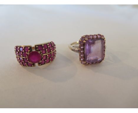 A large emerald cut amethyst ring, with diamond set shoulders on 9ct gold, size N 1/2 - and a 9ct gold and ruby dress ring in