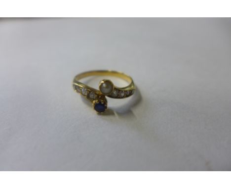 An 18ct diamond sapphire and pearl ring, size N, approx 2.8 grams, not hallmarked but tests to 18ct 
