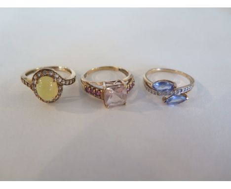 Three 9ct gold dress rings, one with a yellow opal, one with pale amethyst and tanzanite, sizes Na nd O, total weight approx 