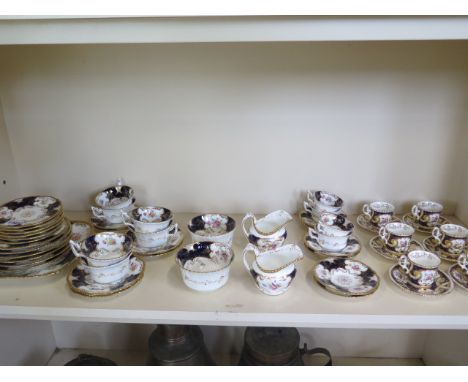 A Coalport part tea service, six Coalport coffee cans of similar design -&nbsp;small firing fault to base of a saucer, light 