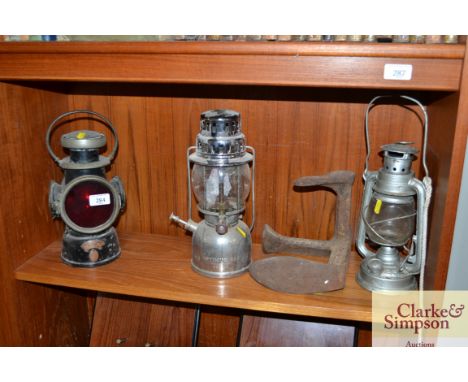 A Lucas "King of the Road" back light and an old hurricane lamp, an Optimus 930 tilly style lamp and a cast iron cobbler's la