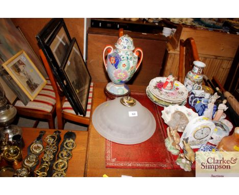 A frosted glass pendant light shade and an Imari patterned table lamp base