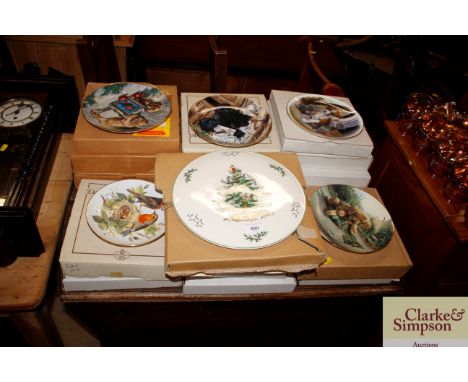 A quantity of collectors plates from Puppy Play Time with boxes and a Spode Christmas Tree plate