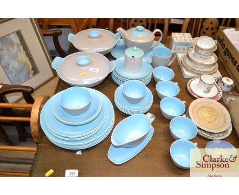 A quantity of Poole pottery twin tone tea and dinnerware