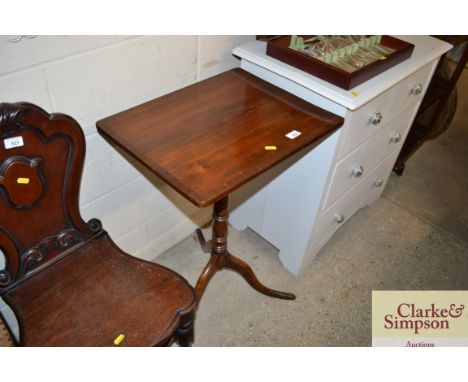 A mahogany and crossbanded tripod occasional table