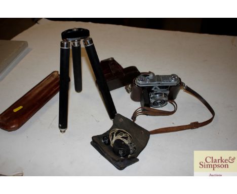 A Kodak camera in leather case; a tripod and a monocular