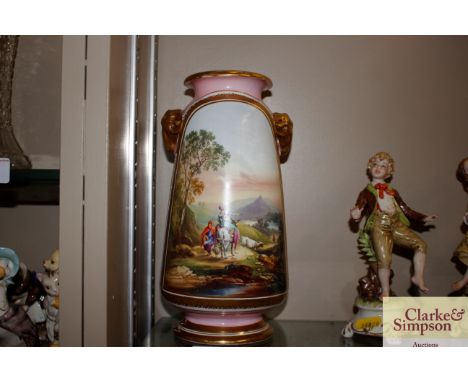 A continental porcelain vase, with gilt rams head handles; a painted scenic panel