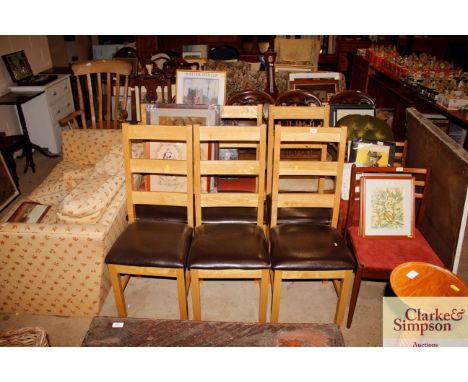 A set of six good quality modern light wood ladder back dining chairs with leatherette upholstered seats