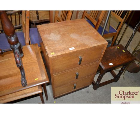 An Art Deco style light oak three drawer chest