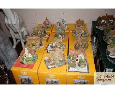 Twelve Lilliput Lane cottages, A Year In An English Garden, Bar Gate Cottage Tearoom, Rose Cottage and others, some with boxe