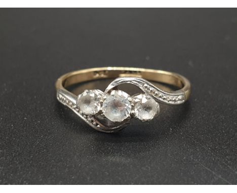 A VINTAGE 9KT GOLD CROSSOVER RING WITH 3 SMALL DIAMONDS SET IN PALLADIUM.2.0gms   size M 