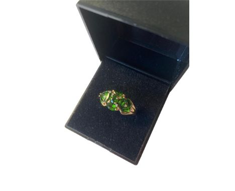 9 carat gold QVC ring having green gemstones and diamonds to top .Size R. 2.9 grams.Fully Hallmarked. 